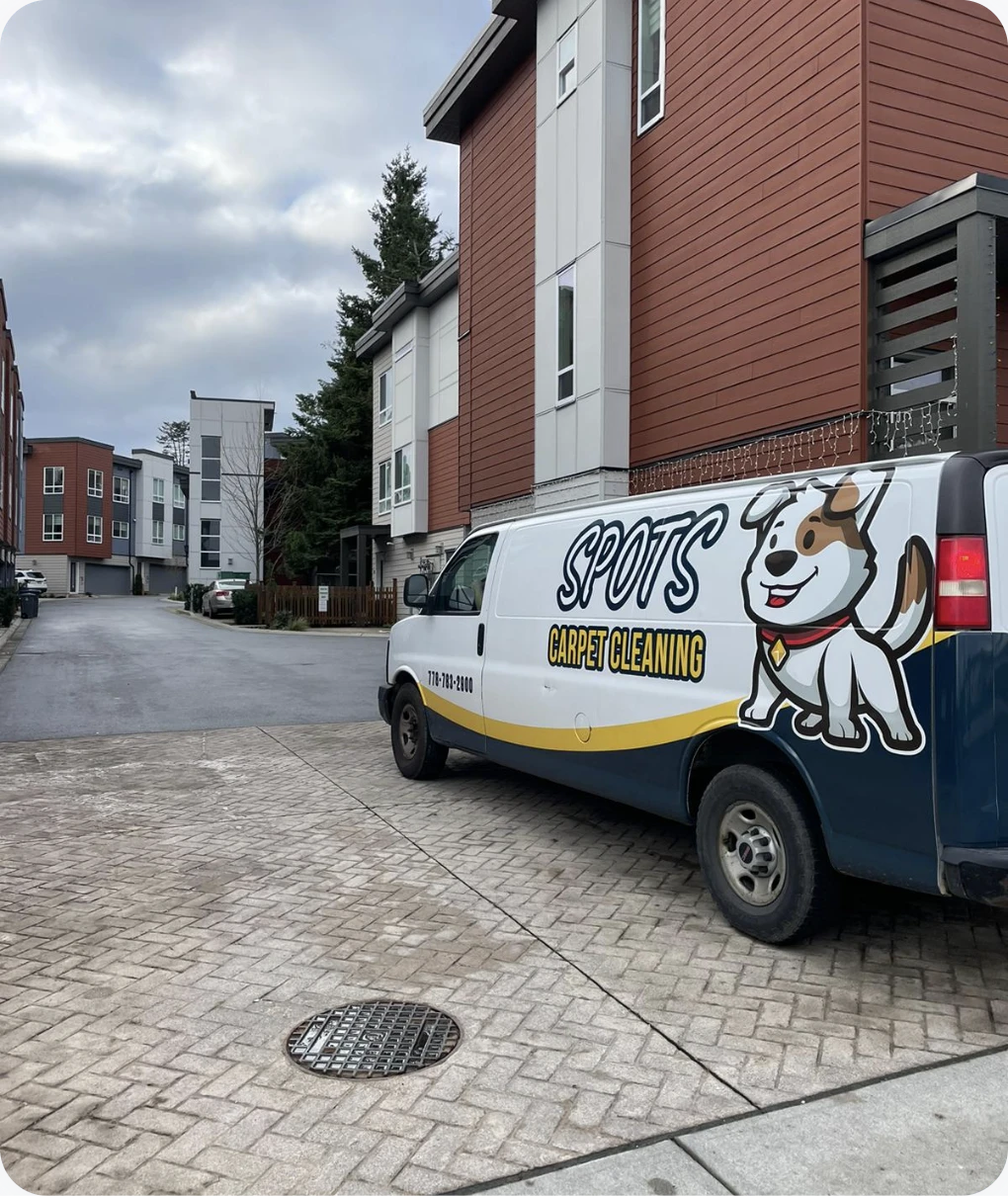Spots carpet cleaning vehicle at a local job